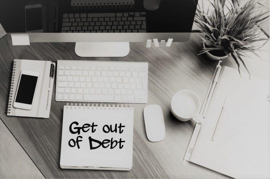 get out of debt by living half your income