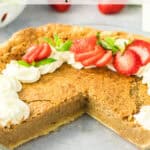 A backwoods pie with a missing slice, topped with whipped cream and sliced strawberries, sits on a table. The pie has a rustic, golden-brown crust and a soft, maple filling. Text reads: “Rustic Flavor Maple Pie.”.