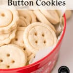 A red bowl with white snowflakes holds round, pale cookies with two or four small holes in the center, resembling buttons. Text on the image reads Holiday Fun Button Cookies..