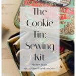A vintage cookie tin repurposed as a sewing kit, filled with thread, scissors, and sewing notions—each item adding to the charm of timeless cookie tin stories. Text overlay reads The Cookie Tin: Sewing Kit with a website link at the bottom.