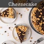 A rich and creamy peanut butter cheesecake, made without baking, is topped with luscious chocolate and crunchy peanuts. Slices are served on plates with chocolate chips and peanuts scattered around for extra indulgence. Text on image reads: no bake Peanut Butter Cheesecake.