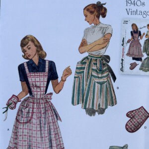 Two women wear vintage 1940s aprons; one is in a pink plaid dress with an apron, the other wears a white blouse and striped skirt. An oven mitt and a small inset of a pattern are also visible.